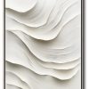 Pure white 3D sculptural wall art with flowing wave-like relief textures. Organic layered ridges cast soft shadows, creating depth through monochromatic light interplay on seamless white background.