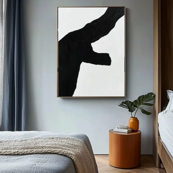 Abstract black sculptural form with rough-textured edges on pure white background. Asymmetrical composition with significant negative space. No text or additional elements.