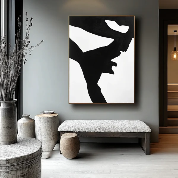 Abstract black geometric human profile silhouette with angular contours against pure white background. No text or discernible details present. Minimalist monochromatic composition.