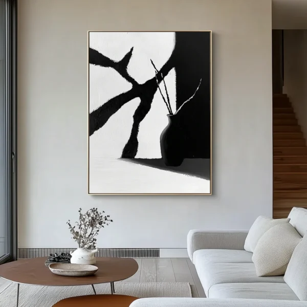 Minimalist oil painting: Black vase holding curved stems stands at lower right, casting shadow on surface. Angular white and charcoal-gray background planes with visible brush texture. No text or discernible words.