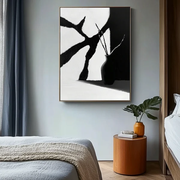 Minimalist oil painting: Black vase holding curved stems stands at lower right, casting shadow on surface. Angular white and charcoal-gray background planes with visible brush texture. No text or discernible words.