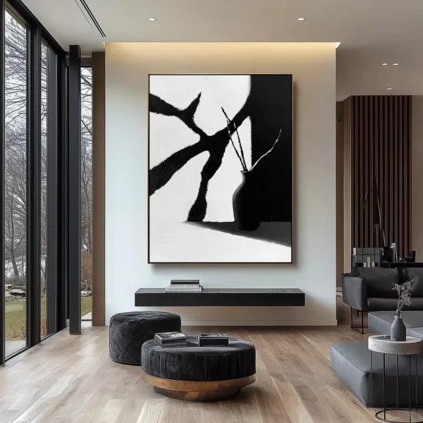 Minimalist oil painting: Black vase holding curved stems stands at lower right, casting shadow on surface. Angular white and charcoal-gray background planes with visible brush texture. No text or discernible words.